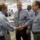 Gabriel Escobar, right, accepts congratulations from Philadelphia Inquirer Editor William K. Marimow after Stan Wischnowski, Philadelphia Media Network executive editor and senior vice president, center, announced that Escobar is being promoted to the new position of PMN editor and vice president. Michael Days, in background, becomes PMN editor for reader engagement. (Clem Murray/philly.com)